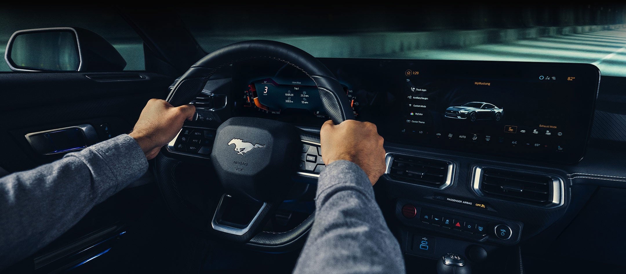 A 2024 Ford Mustang® model interior with a person driving | Coughlin Ford of Pataskala in Pataskala OH